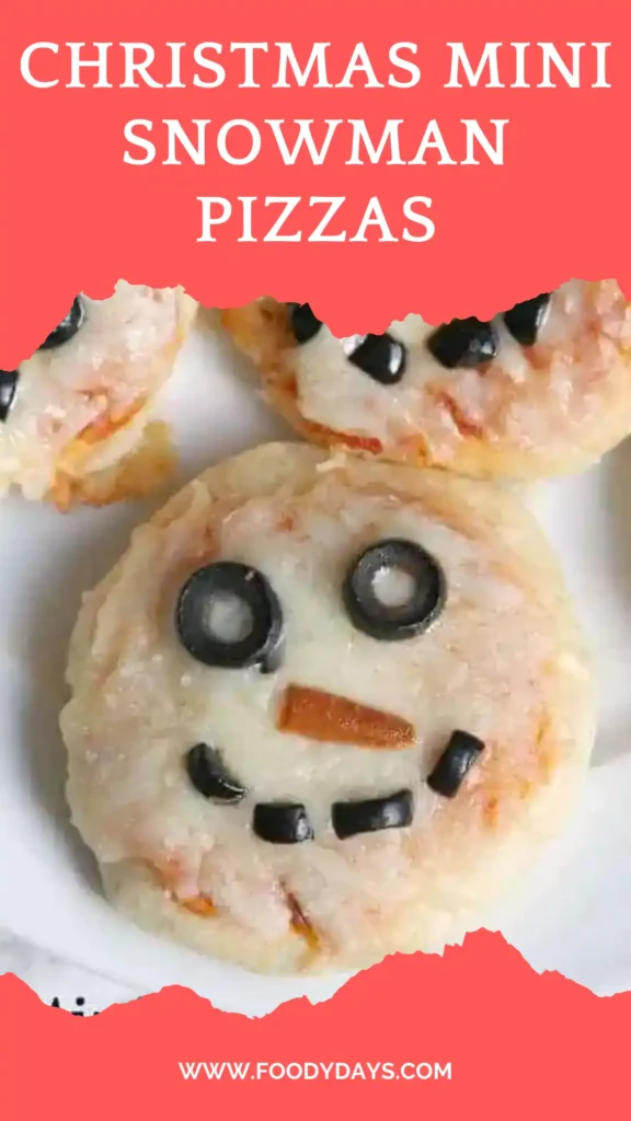 Family-style mini snowman pizzas on white marble.