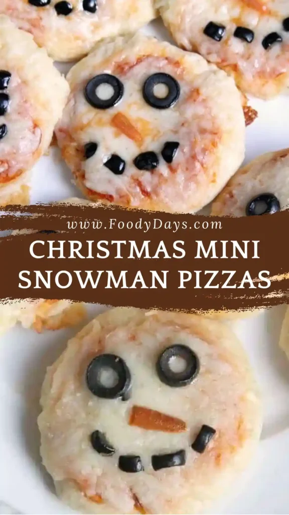 Family-style mini snowman pizzas on white marble.