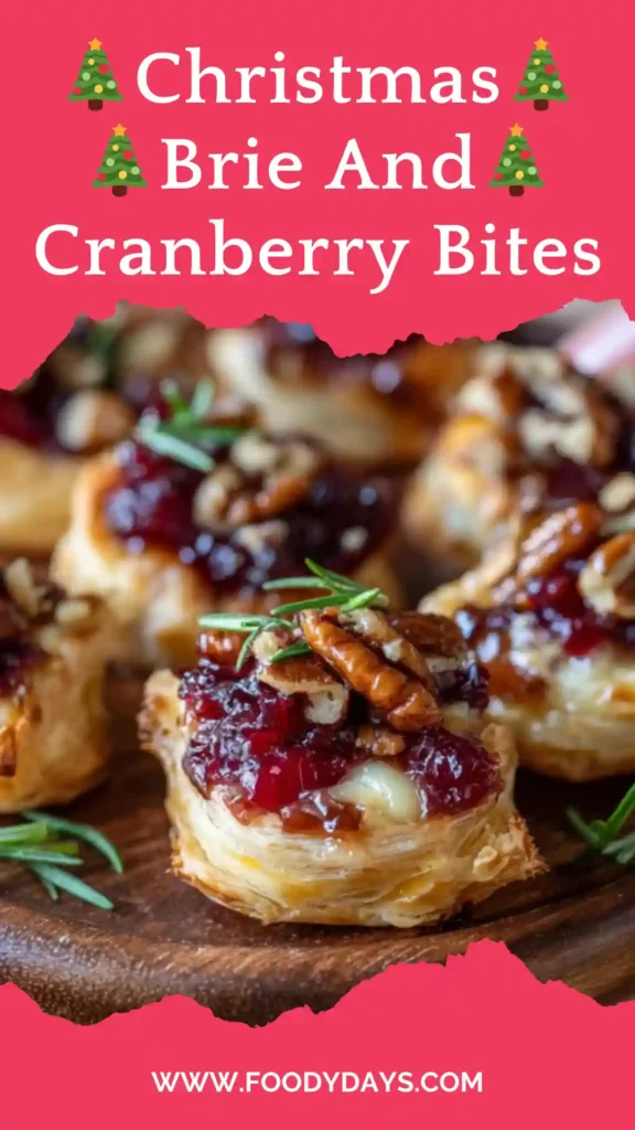 Christmas brie and cranberry bites served on marble platter.
