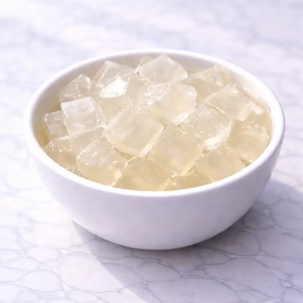 Jillian Michaels Gelatin Recipe cubes served in white bowl on marble surface