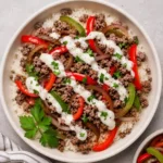 Ground Beef Philly Cheesesteak Bowl with melted provolone and peppers