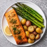 Herb Roasted Salmon Asparagus Potatoes meal prep containers